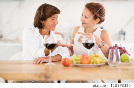 Party for girlfriends - women drinking wine and telling each other news 138578320