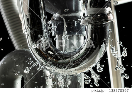 There is leak in water pipe under the sink, drain is clogged. Water Leak around pipe because sink is draining slowly and splashing with many pipes There is leak in water pipe under the sink, drain is clogged. Water Leak around pipe because sink is draining slowly and splashing with many pipes 138578597