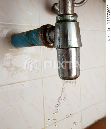 There is leak in water pipe under the sink, drain is clogged. Water Leak around pipe because sink is draining slowly and splashing in house home, high speed shutter freeze motion photo There is leak in water pipe under the sink, drain is clogged. Water Leak around pipe because sink is draining slowly and splashing in house home, high speed shutter freeze motion photo 138578603