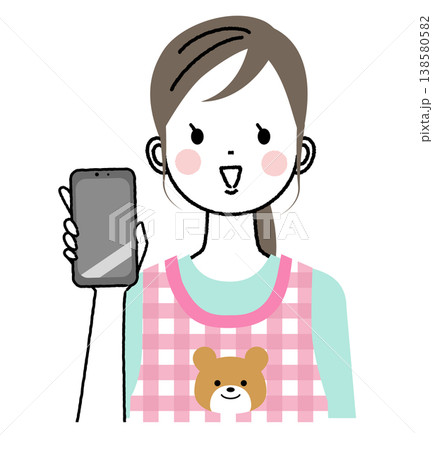 エプロンをつけた保育士のイラスト　スマートフォンの画面をこちらに見せている 138580582