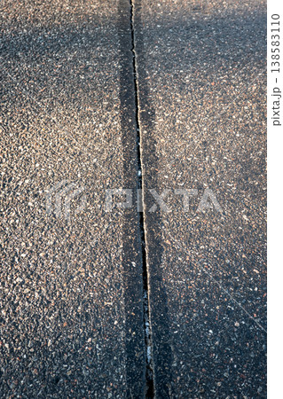 Asphalt Road Pavement Joint Detail Showing Linear Surface Separation Asphalt Road Pavement Joint Detail Showing Linear Surface Separation 138583110