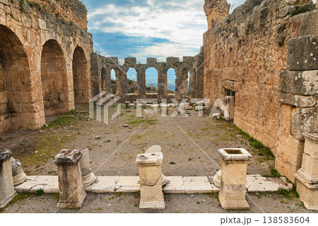 Great Roman bath in rock of ancient Greek city Tlos in Lycia located on Lycian way. Famous historical site In Antalya region. Popular place for family travel on summer vacation. Fethiye, Turkey 138583604