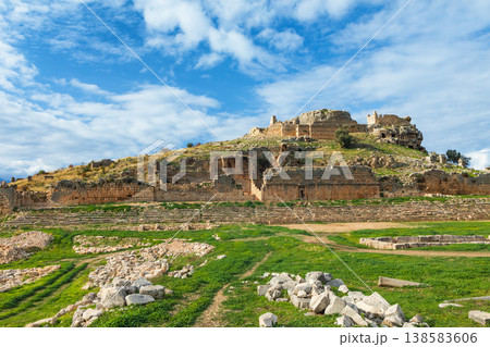 Acropolis, carved in rock tombs of ancient Greek city Tlos in Lycia located on Lycian way. Famous historical site In Antalya region. Popular place for family travel on summer vacation. Fethiye, Turkey Acropolis, carved in rock tombs of ancient Greek city Tlos in Lycia located on Lycian way. Famous historical site In Antalya region. Popular place for family travel on summer vacation. Fethiye, Turkey 138583606
