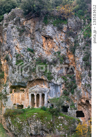 Acropolis, tombs carved in rock of ancient Greek city Tlos in Lycia located on Lycian way. Famous historical site In Antalya region. Popular place for family travel on summer vacation. Fethiye, Turkey Acropolis, tombs carved in rock of ancient Greek city Tlos in Lycia located on Lycian way. Famous historical site In Antalya region. Popular place for family travel on summer vacation. Fethiye, Turkey 138583612