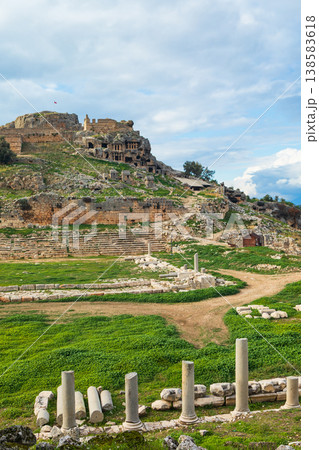 Stadium, acropolis of ancient Greek city Tlos in Lycia located on Lycian way. Famous historical site In Antalya region. Popular place for family travel on summer vacation. Fethiye, Turkey Stadium, acropolis of ancient Greek city Tlos in Lycia located on Lycian way. Famous historical site In Antalya region. Popular place for family travel on summer vacation. Fethiye, Turkey 138583618