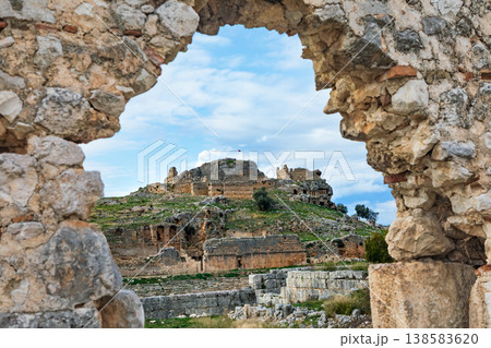 Acropolis, tombs carved in rock of ancient Greek city Tlos in Lycia located on Lycian way. Famous historical site In Antalya region. Popular place for family travel on summer vacation. Fethiye, Turkey Acropolis, tombs carved in rock of ancient Greek city Tlos in Lycia located on Lycian way. Famous historical site In Antalya region. Popular place for family travel on summer vacation. Fethiye, Turkey 138583620
