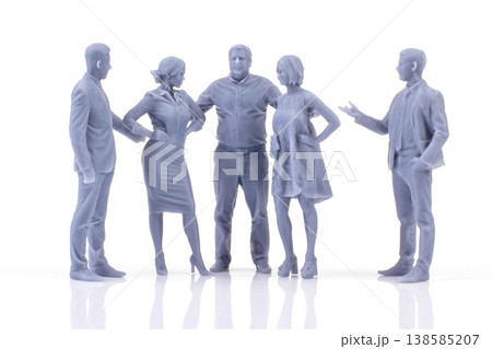 Miniature people engaged in a conversation at a gathering Miniature people engaged in a conversation at a gathering 138585207