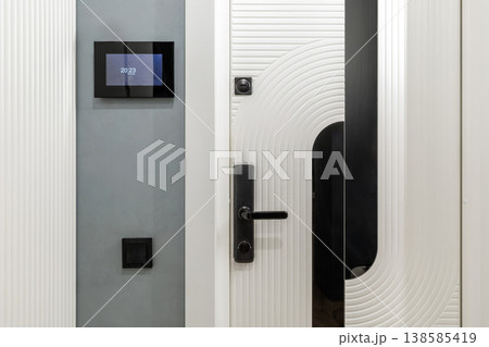 Smart Home Entrance with Digital Intercom and White Door Smart Home Entrance with Digital Intercom and White Door 138585419