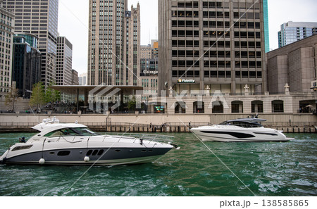 Chicago, Illinois, USA - October 12, 2024: Luxury yacht on among skyscraper building. Downtown architecture. Skyscraper architecture of city with yacht. Chicago downtown cityscape at Chicago river Chicago, Illinois, USA - October 12, 2024: Luxury yacht on among skyscraper building. Downtown architecture. Skyscraper architecture of city with yacht. Chicago downtown cityscape at Chicago river 138585865