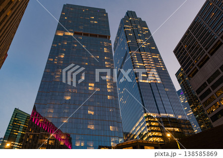 City night illuminated building. Skyscraper cityscape. Night city of Chicago. Business city. Night cityscape of Chicago skyscraper building. Chicago architecture of skyscraper. Twilight glow City night illuminated building. Skyscraper cityscape. Night city of Chicago. Business city. Night cityscape of Chicago skyscraper building. Chicago architecture of skyscraper. Twilight glow 138585869