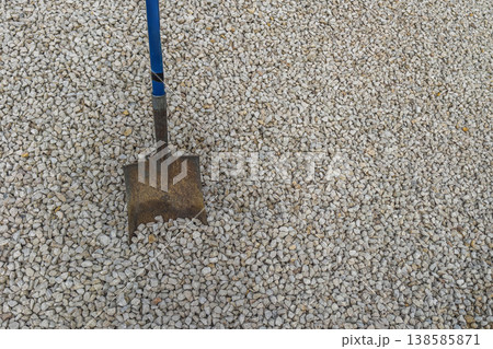 Shovel digging gravel ground outdoor work 138585871