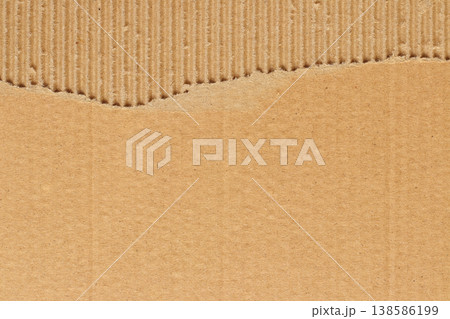 Brown cardboard sheet abstract background, texture of recycle paper box in old vintage pattern with ripped edges. 138586199