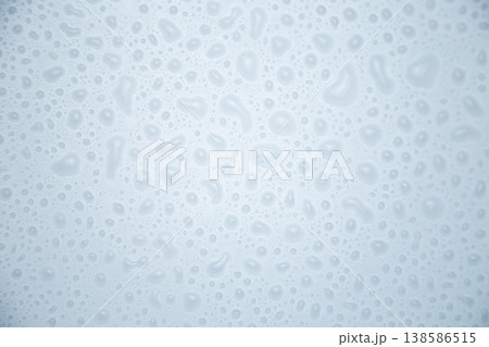 Large water droplets on a white background close-up. The concept of water, rain, humidification. High quality photo Large water droplets on a white background close-up. The concept of water, rain, humidification. High quality photo 138586515