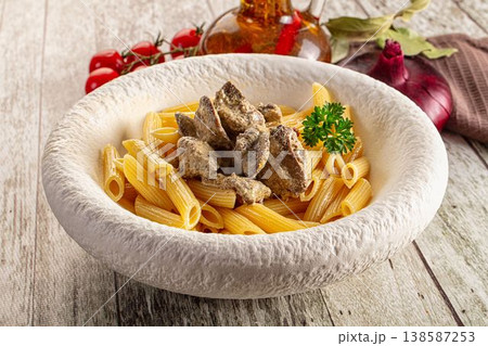 Italian pasta penne with chicken liver 138587253