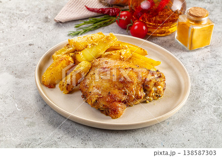 Baked chicken thighs with potatoes Baked chicken thighs with potatoes 138587303