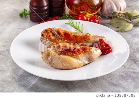 Roasted rabbit leg served rosemary 138587308