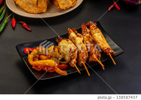 Grilled Chicken Skewers with Melted Cheese and Vegetables Grilled Chicken Skewers with Melted Cheese and Vegetables 138587437