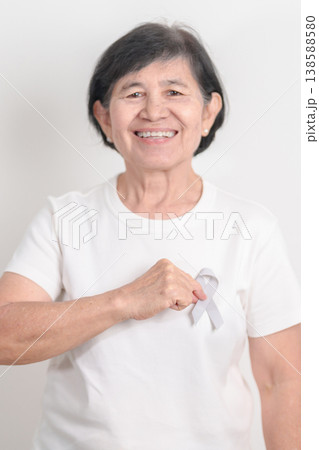 Elderly with Gray ribbon for May Brain Cancer Awareness month and Asthma Awareness, Support life people Survivor. Healthcare and February World cancer day Elderly with Gray ribbon for May Brain Cancer Awareness month and Asthma Awareness, Support life people Survivor. Healthcare and February World cancer day 138588580