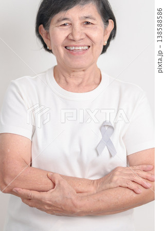 Elderly with Gray ribbon for May Brain Cancer Awareness month and Asthma Awareness, Support life people Survivor. Healthcare and February World cancer day Elderly with Gray ribbon for May Brain Cancer Awareness month and Asthma Awareness, Support life people Survivor. Healthcare and February World cancer day 138588586