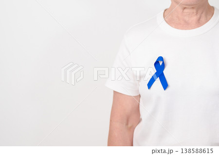 Elderly with dark Blue or Navy blue Ribbon for concept of March Colorectal and Colon Cancer Awareness month, May Arthritis awareness, July Juvenile arthritis and Childhood. Health and world cancer day 138588615