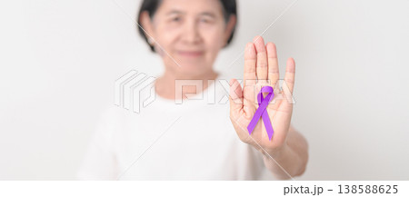 Elderly with Purple Ribbon for Violence, Pancreatic, Esophageal, Testicular cancer, Alzheimer, Epilepsy, Lupus, Crohn, Thyroid,  Sarcoidosis and Fibromyalgia. Awareness month and World cancer day 138588625