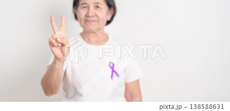 Elderly with Purple Ribbon for Violence, Pancreatic, Esophageal, Testicular cancer, Alzheimer, Epilepsy, Lupus, Crohn, Thyroid,  Sarcoidosis and Fibromyalgia. Awareness month and World cancer day 138588631