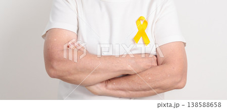 Elderly with Yellow Ribbon for concept of yellow September, Suicide prevention day, Childhood, Pediatric, May Missing Children Awareness day month, support survivor. Healthcare and World Cancer day 138588658