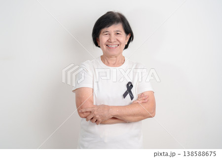 Elderly with Black ribbon for May Melanoma and skin cancer Awareness month, October Vaccine injury awareness month, Mourning Remembrance, March Sleep awareness week, Gang Prevention and Anti Violence Elderly with Black ribbon for May Melanoma and skin cancer Awareness month, October Vaccine injury awareness month, Mourning Remembrance, March Sleep awareness week, Gang Prevention and Anti Violence 138588675