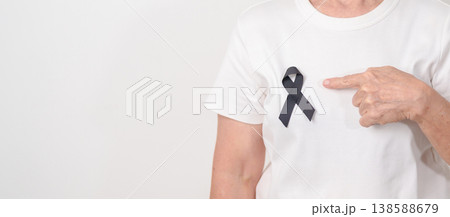 Elderly with Black ribbon for May Melanoma and skin cancer Awareness month, October Vaccine injury awareness month, Mourning Remembrance, March Sleep awareness week, Gang Prevention and Anti Violence Elderly with Black ribbon for May Melanoma and skin cancer Awareness month, October Vaccine injury awareness month, Mourning Remembrance, March Sleep awareness week, Gang Prevention and Anti Violence 138588679