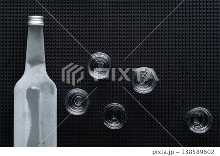 Vodka bottle with shot glasses 138589602