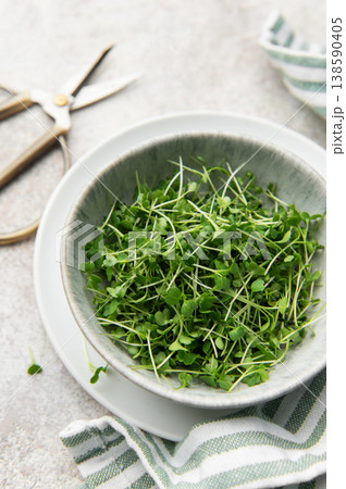 Fresh microgreens in bowl with scissors for healthy eating Fresh microgreens in bowl with scissors for healthy eating 138590405
