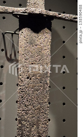 Close up of corroded medieval sword blade with visible texture and marks displayed in museum in Malbork Castle Poland. Detail, material and history concept 138590488