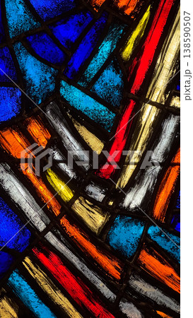 Close up of colorful stained glass pattern with blue red yellow and white elements in Malbork Castle Poland. Light, color and abstract design concept Close up of colorful stained glass pattern with blue red yellow and white elements in Malbork Castle Poland. Light, color and abstract design concept 138590507