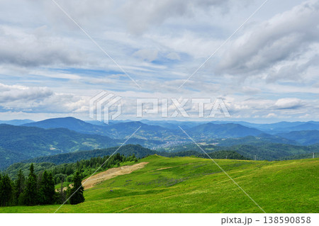 Green Meadow with Mountain Panorama 138590858
