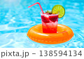 Refreshing Summer Drink Floating in Pool 138594134