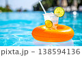 Refreshing Summer Drink Floating in Pool 138594136