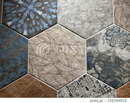 Hexagonal tiles with various textures and patterns create an intricate geometric background Hexagonal tiles with various textures and patterns create an intricate geometric background 138594816