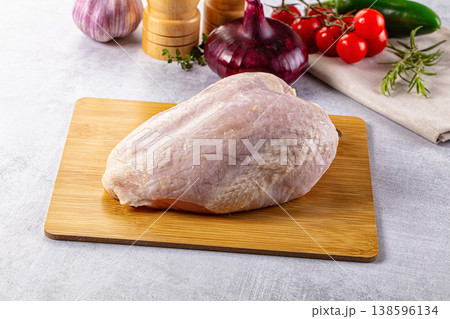 Raw chicken breast with bone and skin Raw chicken breast with bone and skin 138596134