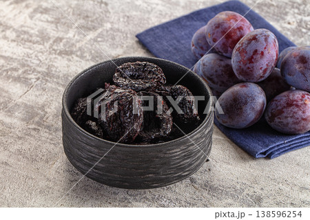 Black dry sweet prunes heap Black dry sweet prunes heap 138596254