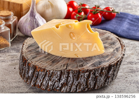 Yellow maasdam cheese triangle piece Yellow maasdam cheese triangle piece 138596256