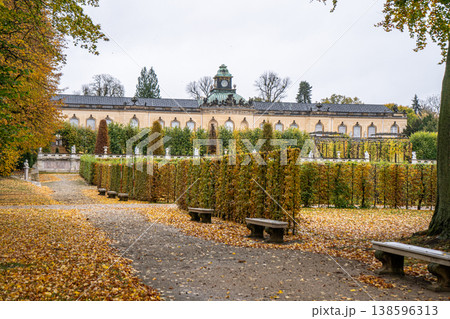 Autumn Garden with Palace and Benches. Alley of trees in fall park in Potsdam Germany. Old plant nature Autumn Garden with Palace and Benches. Alley of trees in fall park in Potsdam Germany. Old plant nature 138596313