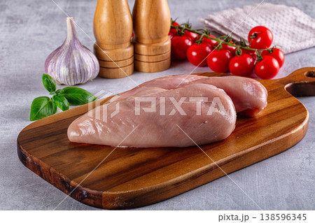 Fresh raw chicken breast over board Fresh raw chicken breast over board 138596345