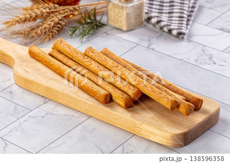 Baked Italian Grissini sticks heap 138596358