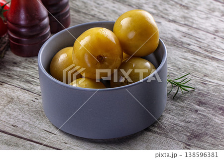 Pickled green tomatoes in the bowl Pickled green tomatoes in the bowl 138596381