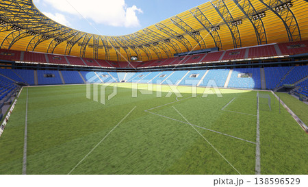 3D render of an empty modern football stadium. Sunny day at a soccer arena with green grass pitch 138596529