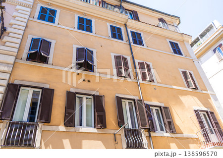Italy Rome balcony street house facade. Old building architecture in the city center. Italian window shutters 138596570