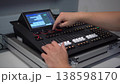 Man controlling professional lighting mixer using stylus 4k 138598170