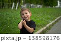 Three year old child walking in park talking on phone closeup. 4k 138598176