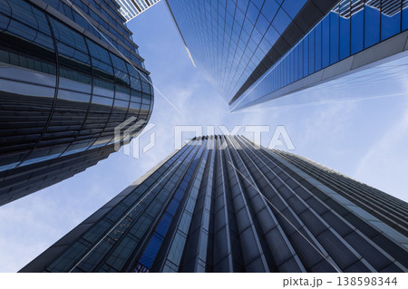 Looking up at corporate office buildings in the financial district Looking up at corporate office buildings in the financial district 138598344