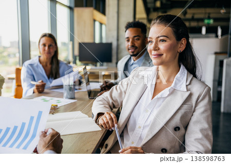 Applicant exuding confidence during evaluation with documents present Applicant exuding confidence during evaluation with documents present 138598763